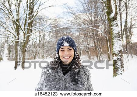 Woman taking a walk in snowy woods View Large Photo Image Stock Image - Woman taking a walk in snowy woods. Fotosearch