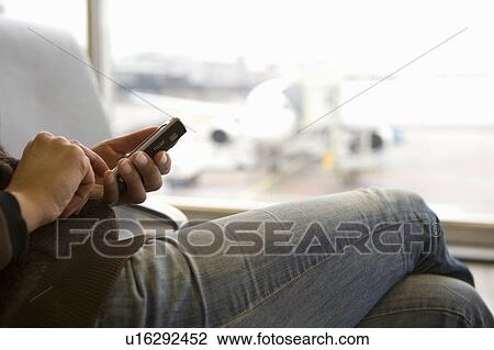 Woman using smart phone body cropped View Large Photo Image Stock Image - Woman using smart phone body cropped. Fotosearch