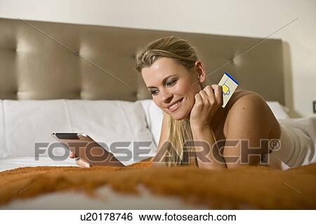 Woman using tablet computer for shopping View Large Photo Image Stock Photograph - Woman using tablet computer for shopping. Fotosearch