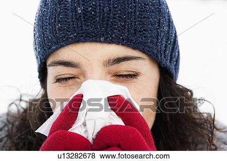 Woman wiping nose close-up View Large Photo Image Stock Photo - Woman wiping nose close-up. Fotosearch