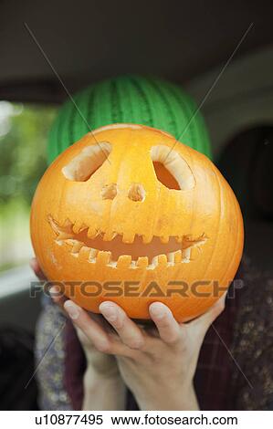 Woman with a pumpkin on Halloween View Large Photo Image Stock Photography - Woman with a pumpkin on Halloween. Fotosearch