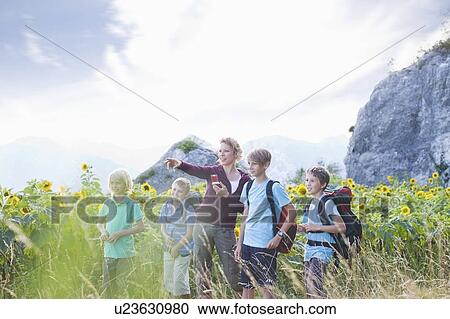 Woman with boys in nature View Large Photo Image Stock Image - Woman with boys in nature. Fotosearch