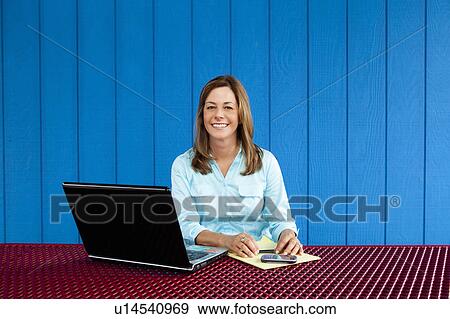 Stock Photo - Woman with laptop. Fotosearch