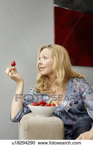 Woman with strawberry View Large Photo Image Stock Image - Woman with strawberry. Fotosearch
