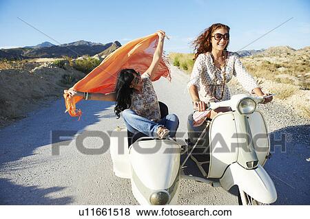 Stock Photo - Women driving with motorbike and sidecar. Fotosearch