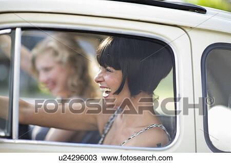 Women in a car View Large Photo Image Stock Image - Women in a car. Fotosearch