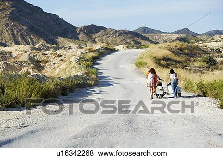 Women pushing motorbike and sidecar View Large Photo Image Stock Photo - Women pushing motorbike and sidecar. Fotosearch