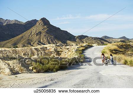 Women pushing motorbike and sidecar View Large Photo Image Stock Photography - Women pushing motorbike and sidecar. Fotosearch