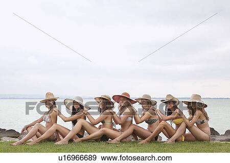 Women sitting in human chain by lake View Large Photo Image Stock Photo - Women sitting in human chain by lake. Fotosearch