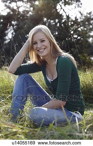 Women sitting in nature smiling View Large Photo Image Stock Photo - Women sitting in nature smiling. Fotosearch