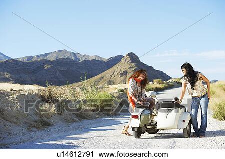 Women sitting on motorbike and sidecar View Large Photo Image Stock Image - Women sitting on motorbike and sidecar. Fotosearch