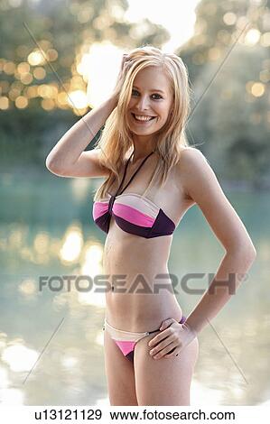 Women smiling in bikini on lake View Large Photo Image Stock Photo - Women smiling in bikini on lake. Fotosearch