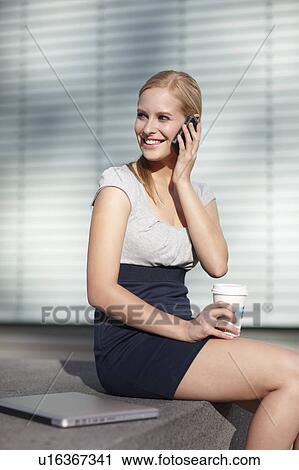 Women with cellphone, laptop and coffee View Large Photo Image Stock Image - Women with cellphone, laptop and coffee. Fotosearch