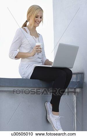 Women with coffee and laptop View Large Photo Image Stock Image - Women with coffee and laptop. Fotosearch