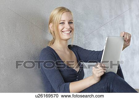 Stock Image - Women with ipad. Fotosearch