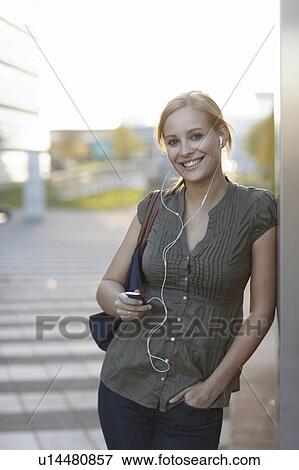 Stock Photo - Women with ipod smiling. Fotosearch