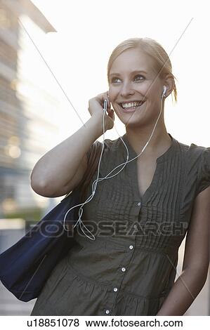 Women with ipod smiling View Large Photo Image Stock Photo - Women with ipod smiling. Fotosearch