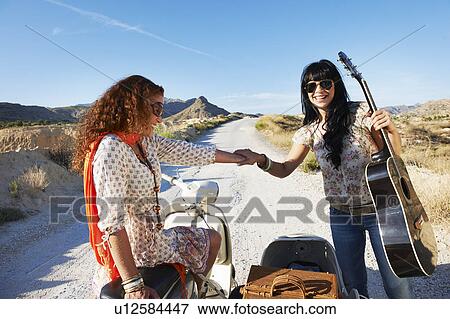 Stock Photo - Women with motorbike and sidecar. Fotosearch