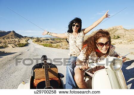 Stock Photo - Women with motorbike and sidecar. Fotosearch