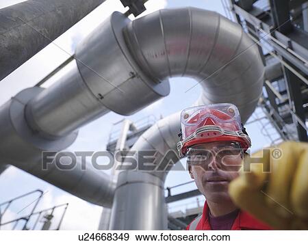 Worker at underground gas storage plant View Large Photo Image Stock Photo - Worker at underground gas storage plant. Fotosearch
