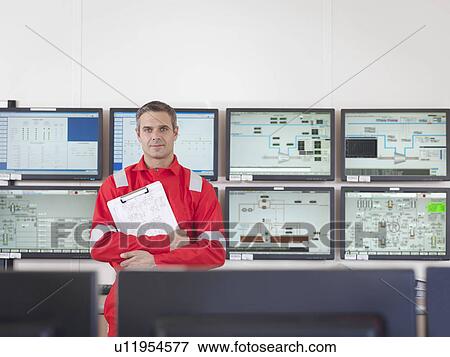 Worker in control room of gas plant View Large Photo Image Stock Photo - Worker in control room of gas plant. Fotosearch