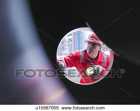 Worker inspects gas storage plant View Large Photo Image Stock Photography - Worker inspects gas storage plant. Fotosearch