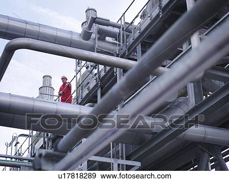 Stock Photo - Worker on underground gas storage plant. Fotosearch