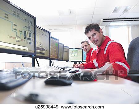 Workers in control room of gas plant View Large Photo Image Stock Photo - Workers in control room of gas plant. Fotosearch
