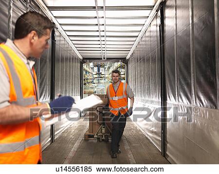 Workers loading truck View Large Photo Image Stock Photography - Workers loading truck. Fotosearch