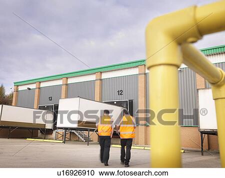 Workers with containers in loading bay View Large Photo Image Stock Image - Workers with containers in loading bay. Fotosearch