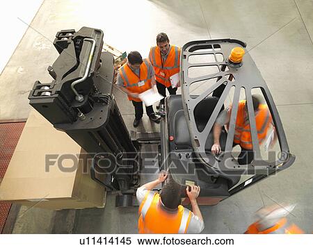 Workers with forklift truck View Large Photo Image Stock Photography - Workers with forklift truck. Fotosearch