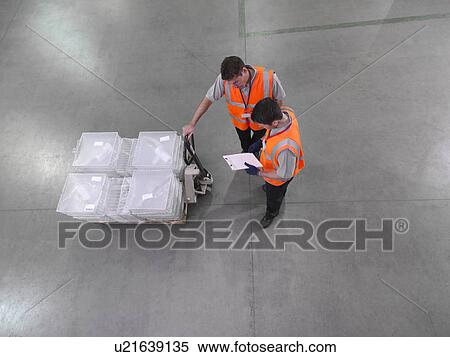 Stock Photography - Workers with pallet truck. Fotosearch