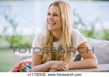 Stock Image - Young beautiful woman smiling. Fotosearch