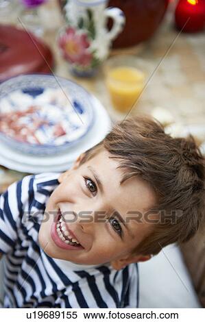 Young boy having lunch View Large Photo Image Stock Photography - Young boy having lunch. Fotosearch