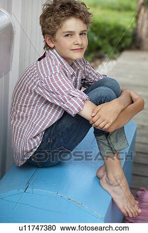 Young boy relaxing View Large Photo Image Stock Image - Young boy relaxing. Fotosearch