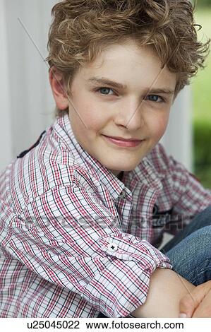 Young boy smiling View Large Photo Image Stock Image - Young boy smiling. Fotosearch