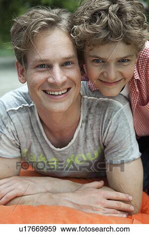 Stock Photo - Young boy with older brother. Fotosearch