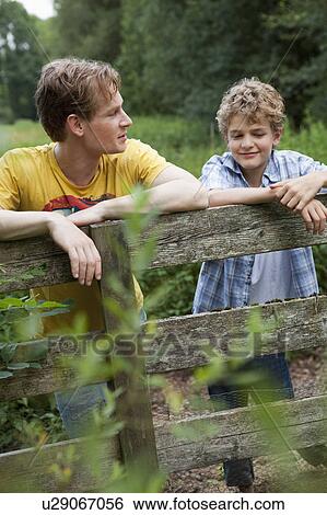 Young boy with older brother View Large Photo Image Stock Photograph - Young boy with older brother. Fotosearch