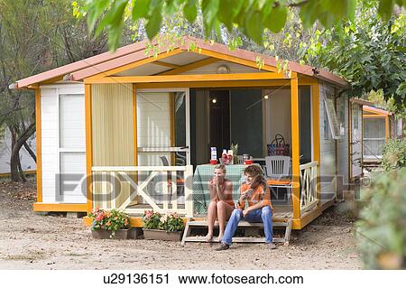 Stock Image - Young cple breakfast at cabin. Fotosearch