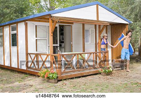 Young cple leave cabin for beach View Large Photo Image Picture - Young cple leave cabin for beach. Fotosearch