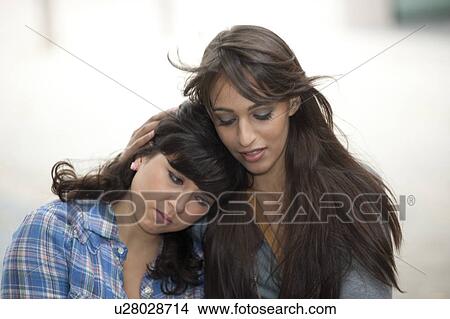 Young female consoling friend View Large Photo Image Picture - Young female consoling friend. Fotosearch
