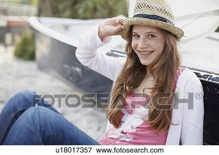 Young girl at beach smiling in camera View Large Photo Image Stock Photo - Young girl at beach smiling in camera. Fotosearch