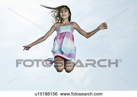 Stock Photograph - Young girl jumping. Fotosearch
