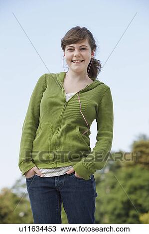 Young girl listening to ipod & laughing View Large Photo Image Stock Image - Young girl listening to ipod & laughing. Fotosearch
