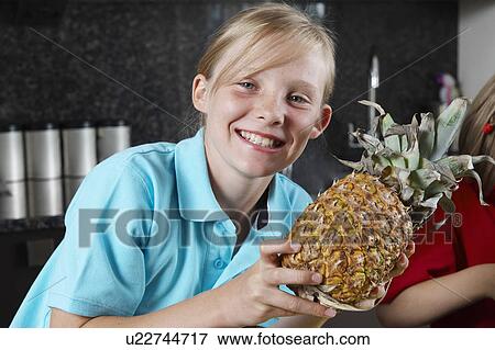 Young Girl preparing food View Large Photo Image Stock Photo - Young Girl preparing food. Fotosearch