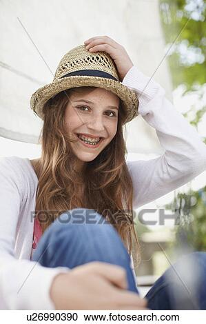Young girl smiling into the camera View Large Photo Image Stock Image - Young girl smiling into the camera. Fotosearch