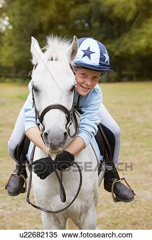 Young girl with pony View Large Photo Image Stock Photography - Young girl with pony. Fotosearch