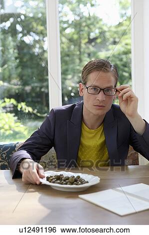 Young male with glasses View Large Photo Image Stock Photograph - Young male with glasses. Fotosearch