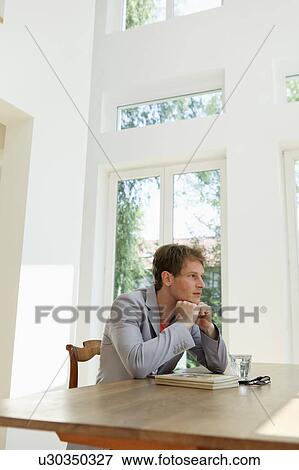 Stock Photo - Young man contemplating. Fotosearch