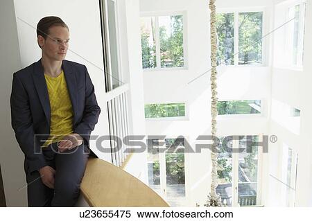 Stock Photography - Young man contemplating. Fotosearch